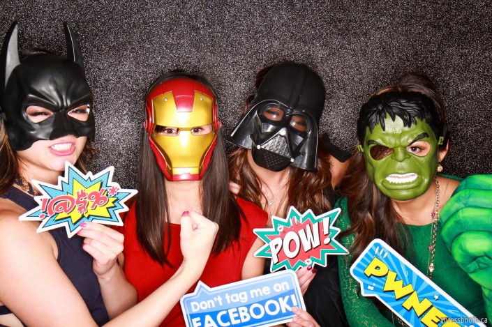 superhero masks with matching pow and pwned photobooth signs