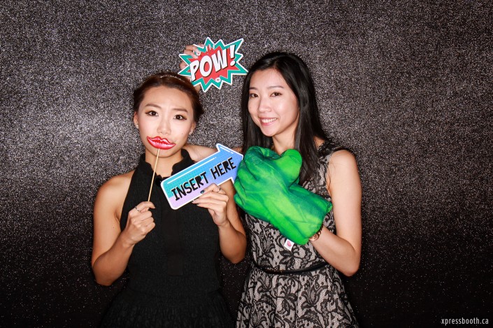 Two lovely ladies posing in front of the photobooth