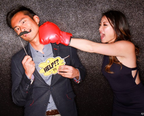 Guy getting punched by pretty girl holding up a help sign and moustache